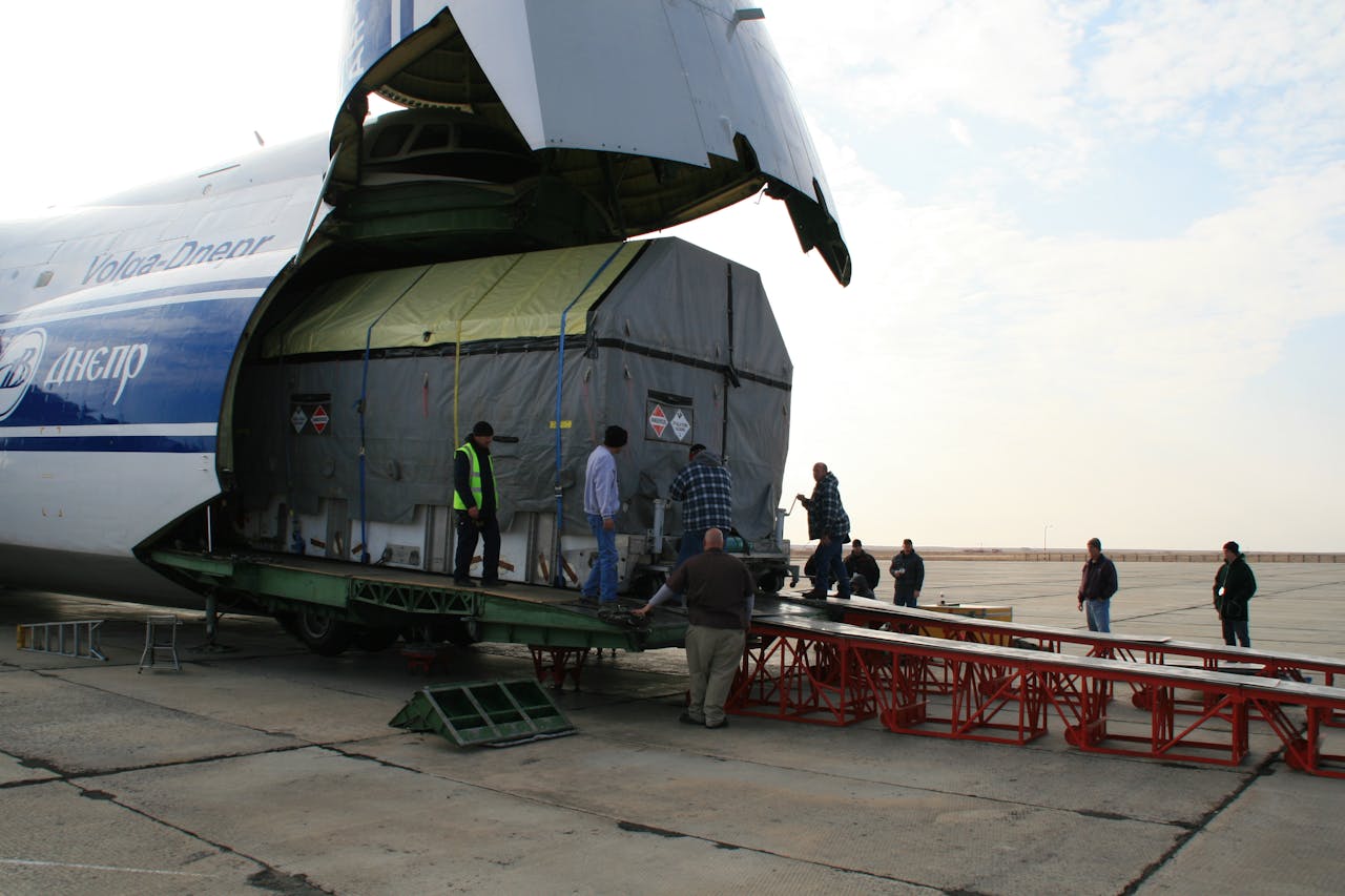 gallery-05 Team unloading cargo from aircraft at Baikonur spaceport.