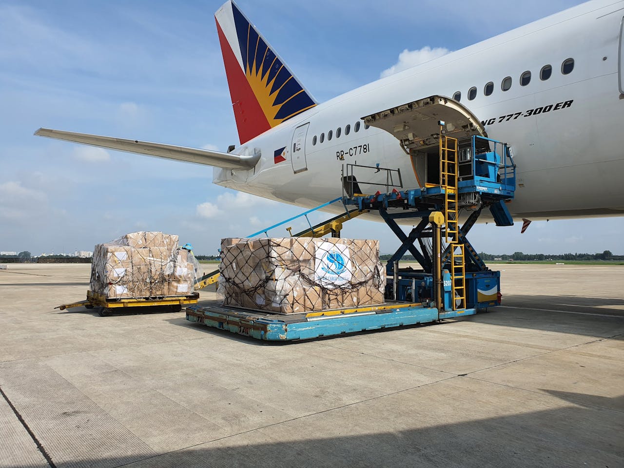 gallery-06 Cargo being loaded onto a commercial airplane at an airport in Ho Chi Minh City, Vietnam.